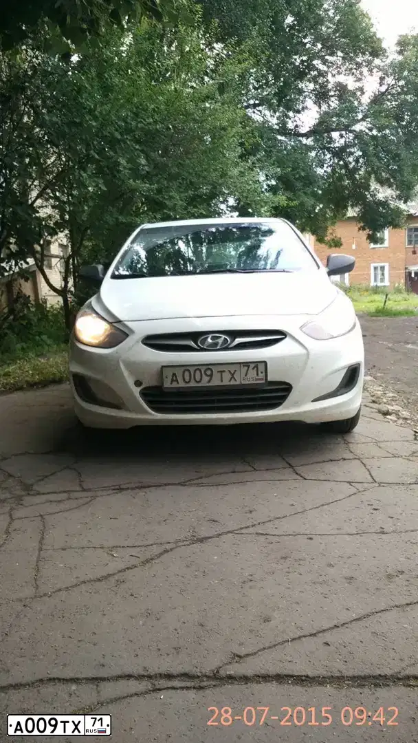 Фото автомобиля КИА РИО, 2016 — госномер О021ТН71. Цвет: БЕЛЫЙ
