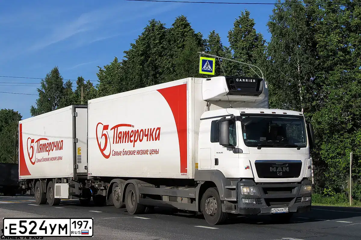 Фото автомобиля MAN TGS, 2012 — госномер Е165ОВ156. Цвет: Белый