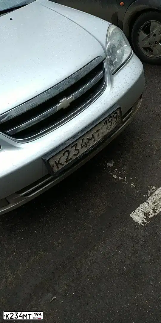 Фото автомобиля CHEVROLET LACETTI, 2008 — госномер К234МТ199. Цвет: СЕРЕБРИСТЫЙ