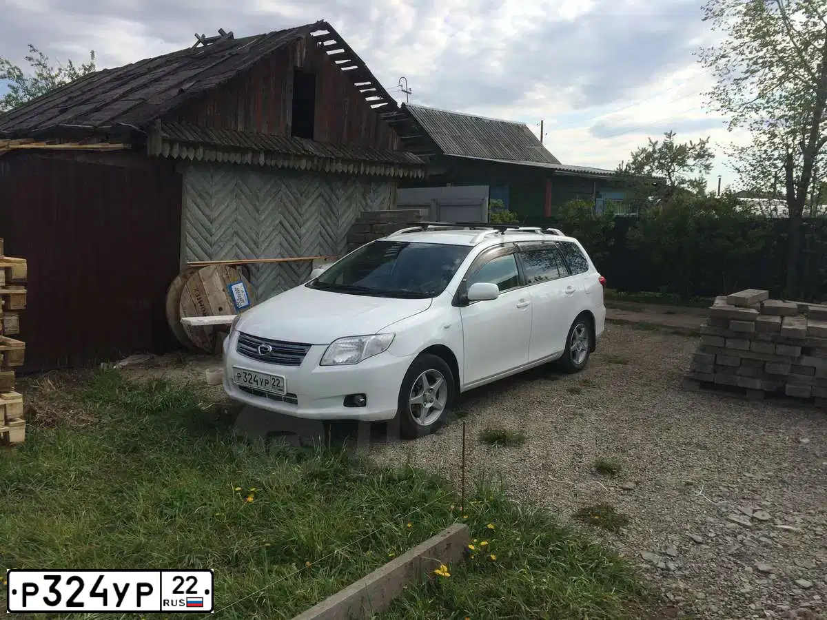 Фото автомобиля TOYOTA COROLLA, 2007 — госномер Р324УР177. Цвет: КРАСНЫЙ