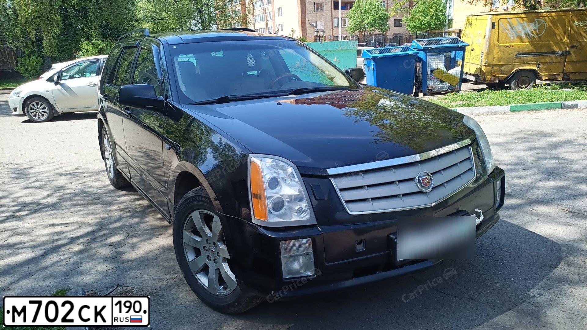 Фото автомобиля CADILLAC SRX, 2008 — госномер М946ВР35. Цвет: ЧЕРНЫЙ