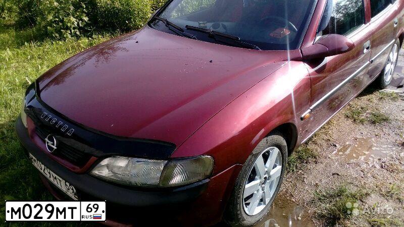 Фото автомобиля OPEL VECTRA, 1997 — госномер М029МТ69. Цвет: ТЕМНО-КРАСНЫЙ