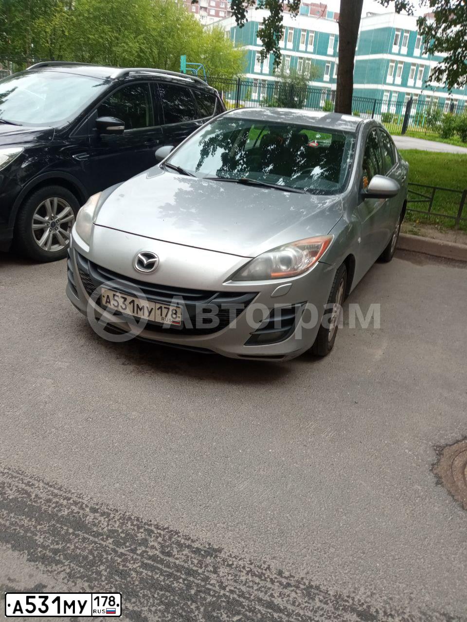 Фото автомобиля MAZDA 3, 2010 — госномер Т804АК154. Цвет: Серебристый