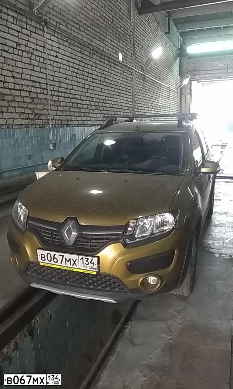 Фото автомобиля RENAULT SANDERO, 2016 — госномер В067МХ134. Цвет: ЗОЛОТИСТО-ЗЕЛЕНЫЙ