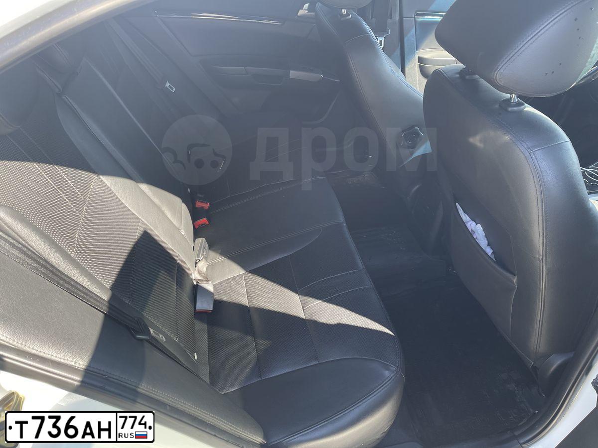 Фото автомобиля GEELY EMGRAND, 2014 — госномер Т736АН774. Цвет: Белый