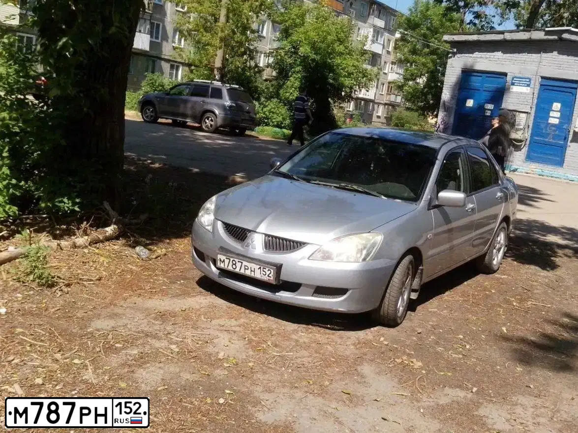 Фото автомобиля MITSUBISHI LANCER, 2004 — госномер А473ТТ152. Цвет: СВЕТЛО-СЕРЫЙ