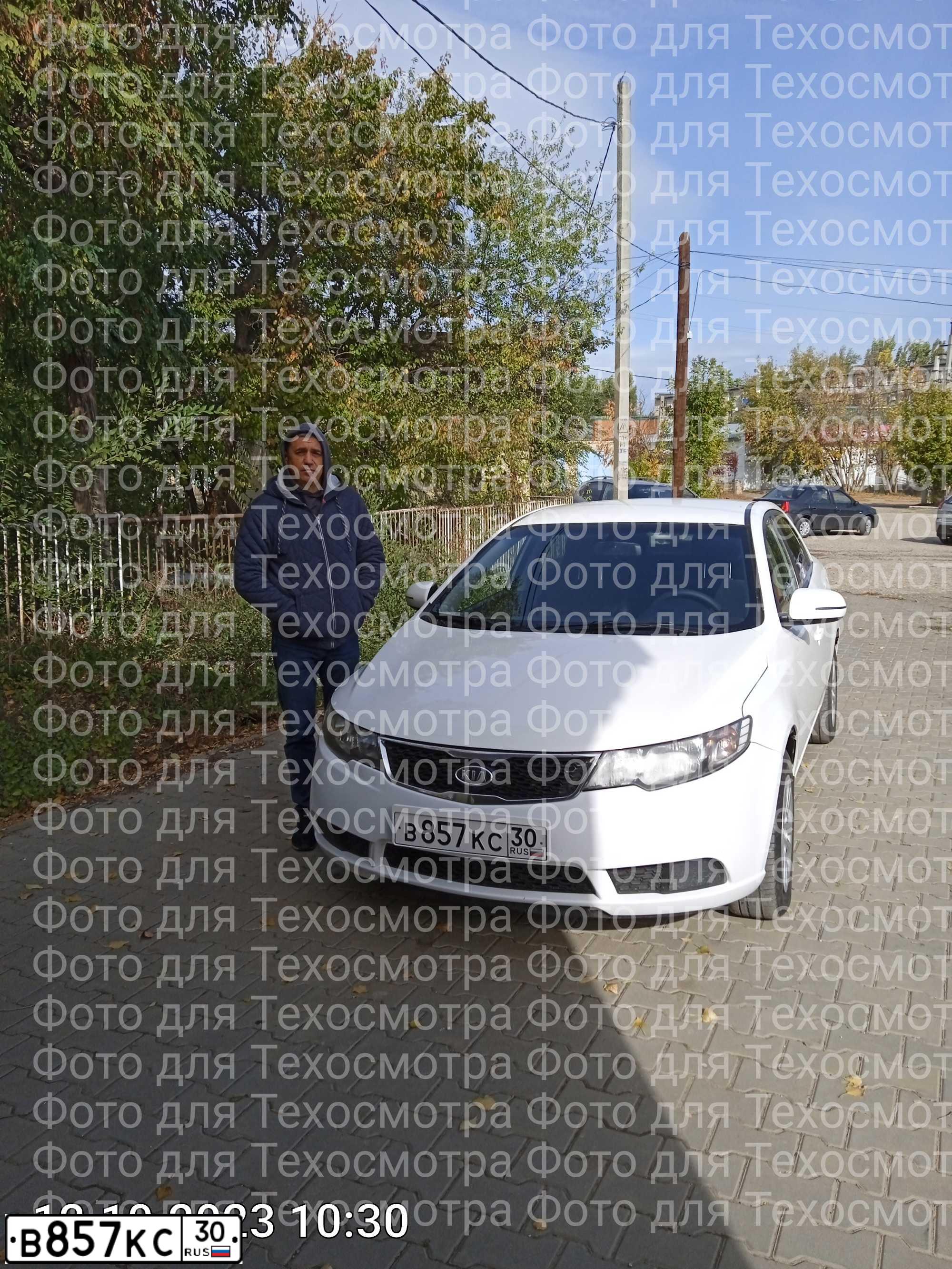 Фото автомобиля KIA CERATO, 2012 — госномер М595УТ134. Цвет: Белый