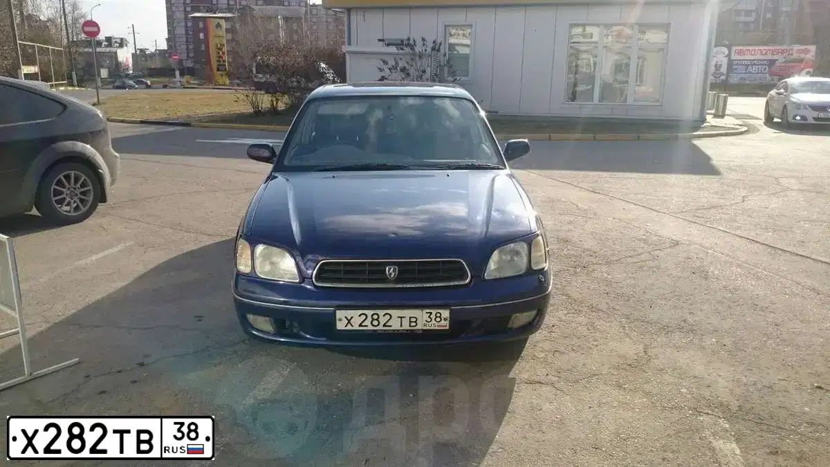 Фото автомобиля SUBARU LEGACY, 1999 — госномер Х282ТВ38. Цвет: синий