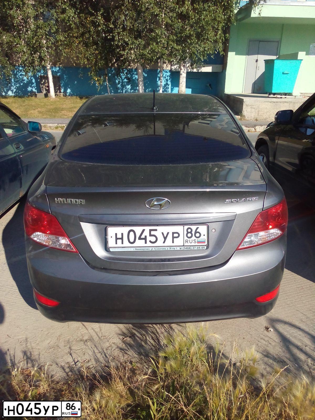 Фото автомобиля HYUNDAI SOLARIS, 2012 — госномер Н045УР86. Цвет: ЧЕРНО-СЕРЫЙ