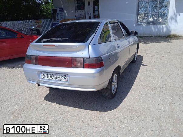 Фото автомобиля LADA 2112, 2001 — госномер В100НЕ82. Цвет: СЕРЕБРИСТО-ГОЛУБОЙ