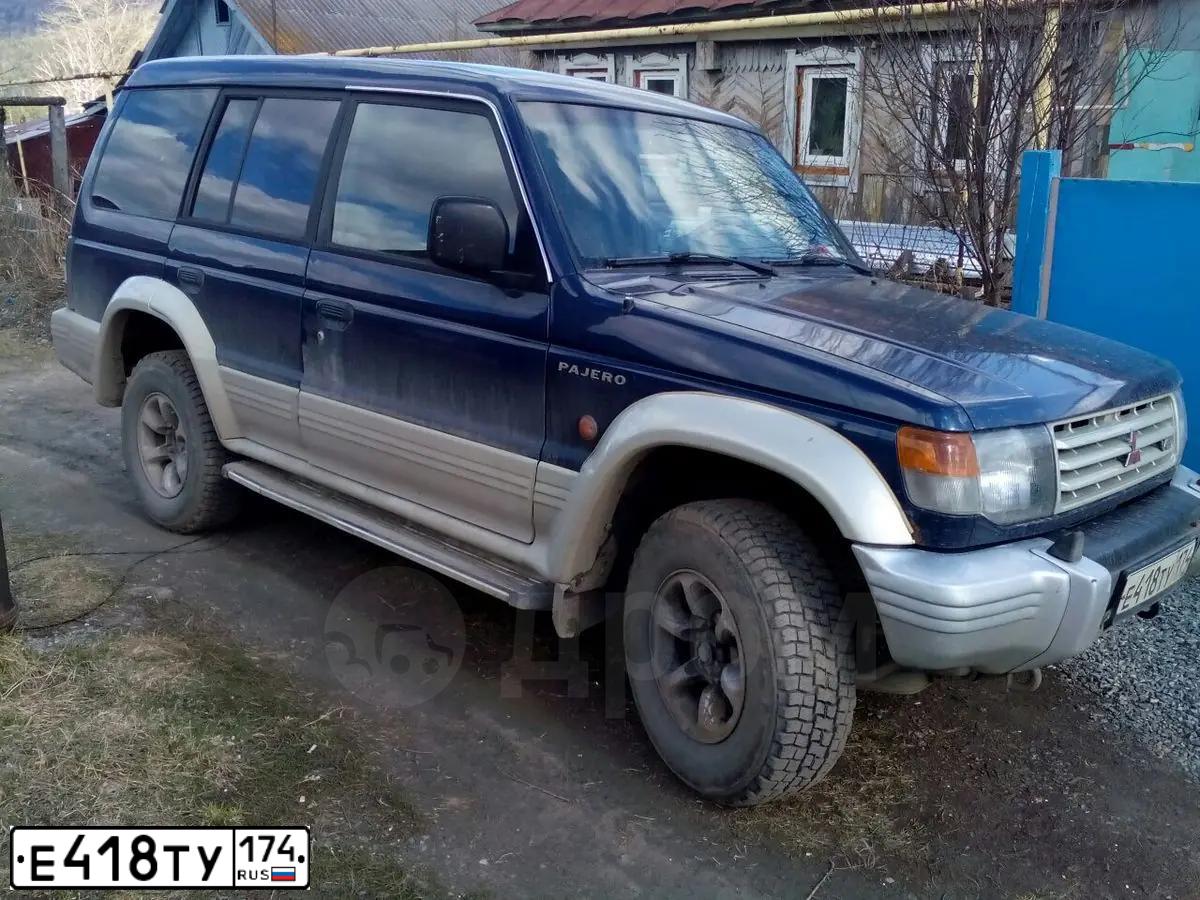 Фото автомобиля MITSUBISHI PAJERO, 1995 — госномер Е418ТУ174. Цвет: синий
