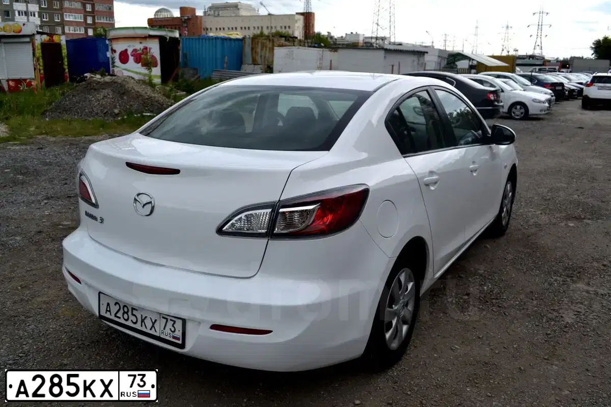 Фото автомобиля MAZDA A 3, 2011 — госномер В411ТН69. Цвет: Белый