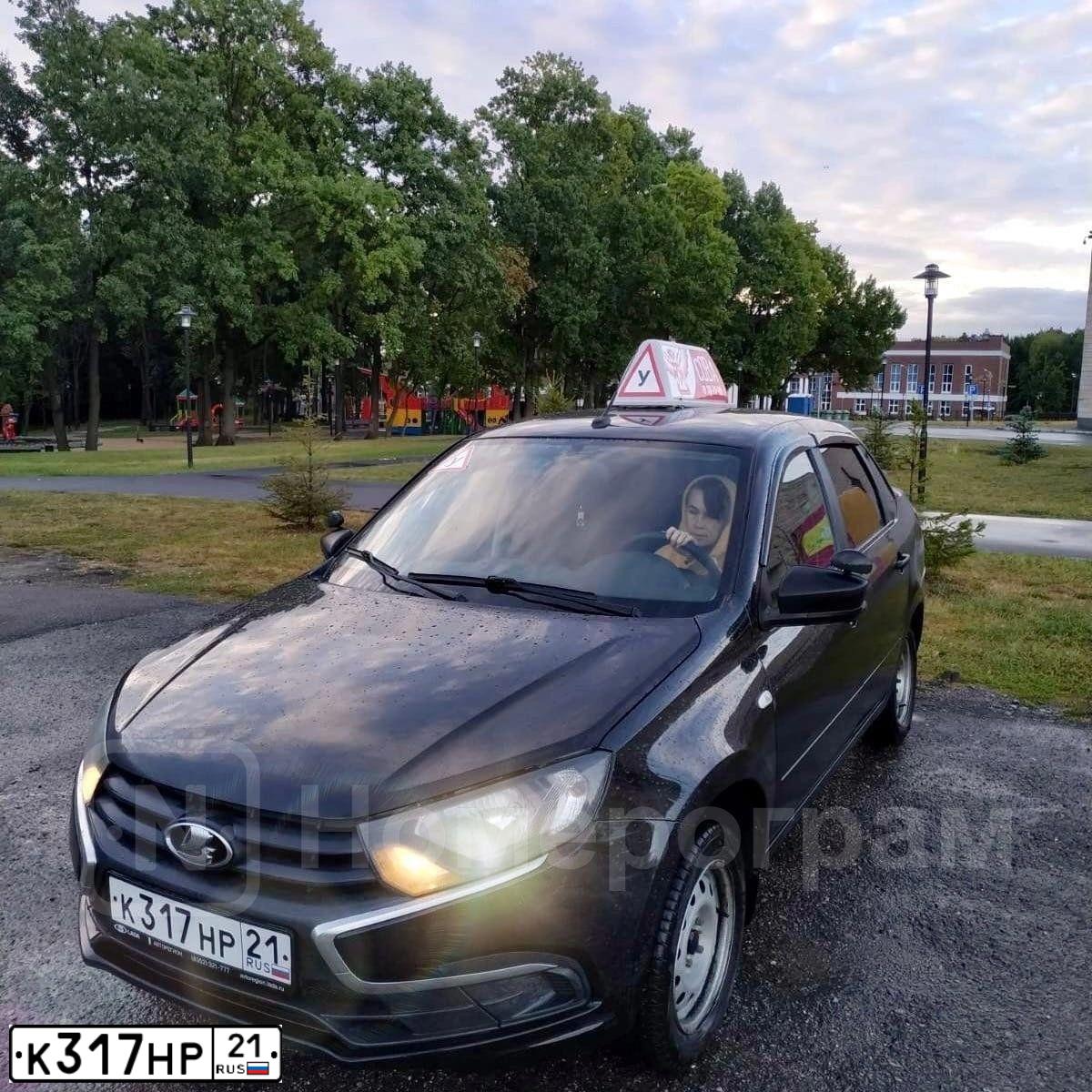 Фото автомобиля LADA 2190 GRANTA, 2019 — госномер К317НР21. Цвет: ЧЕРНЫЙ