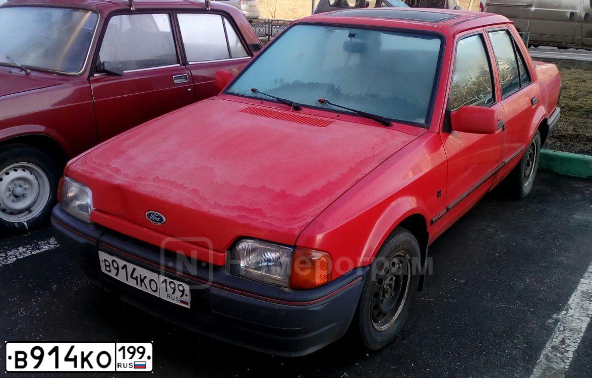 Фото автомобиля FORD ORION, 1989 — госномер Т428ВА774. Цвет: Красный