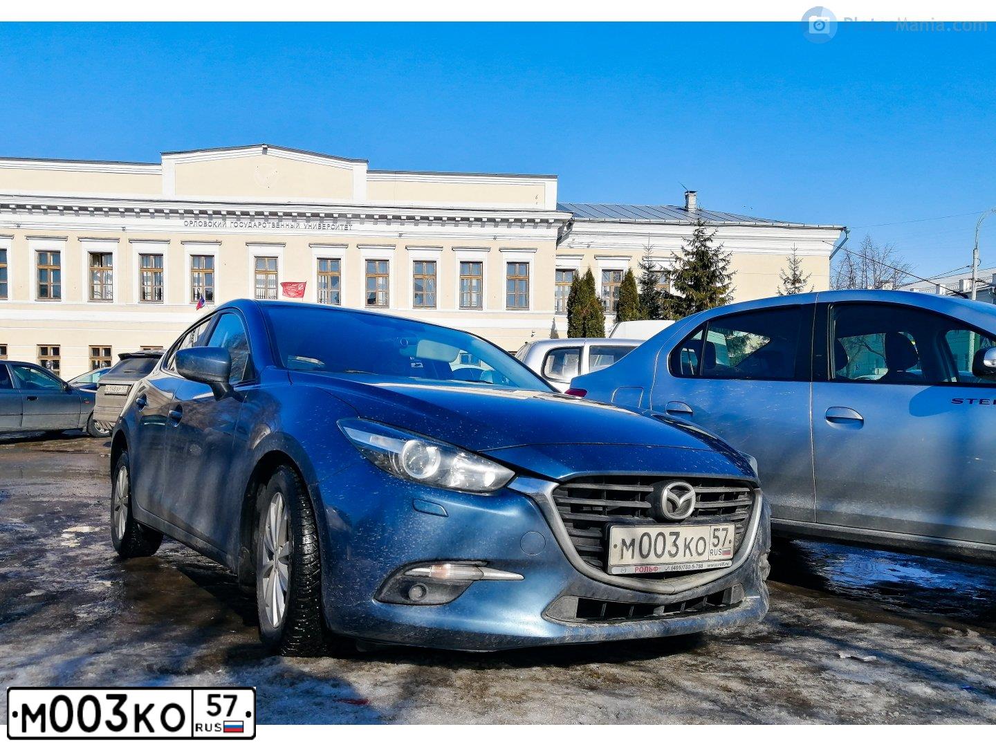 Фото автомобиля MAZDA 3, 2006 — госномер К854ТЕ199. Цвет: Красный