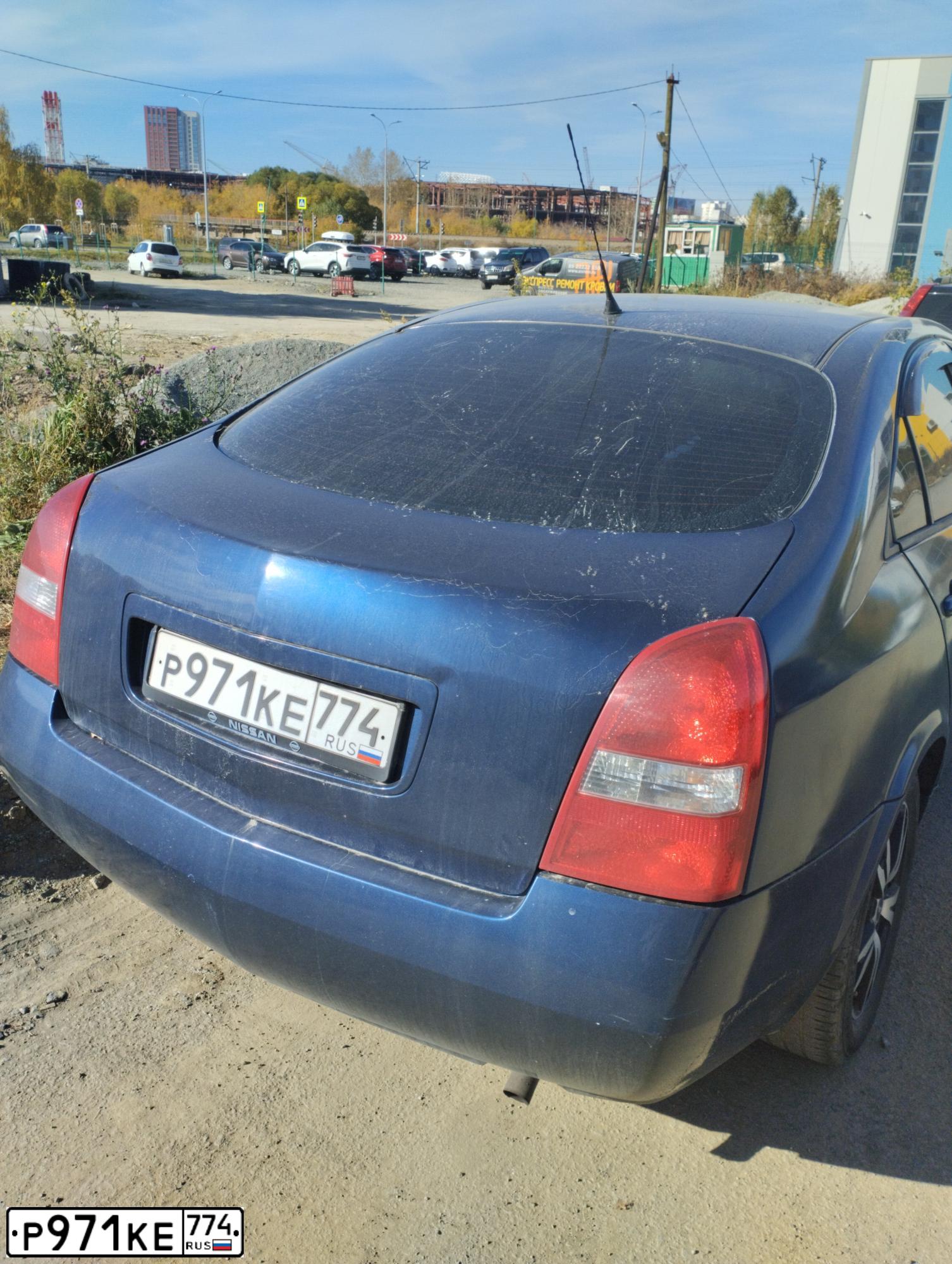 Фото автомобиля NISSAN PRIMERA, 2004 — госномер Р971КЕ774. Цвет: Темно-синий