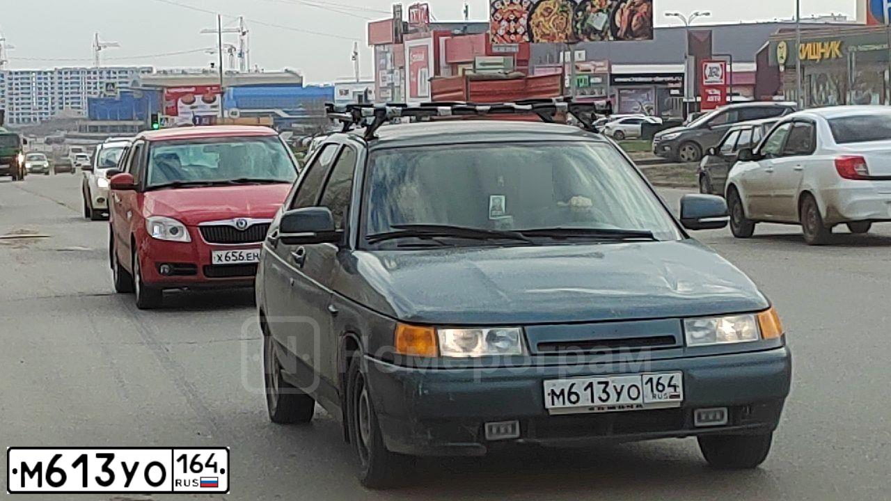 Фото автомобиля LADA 2112, 2006 — госномер М613УО164. Цвет: СЕРО-СИНЕ-ЗЕЛЕНЫЙ