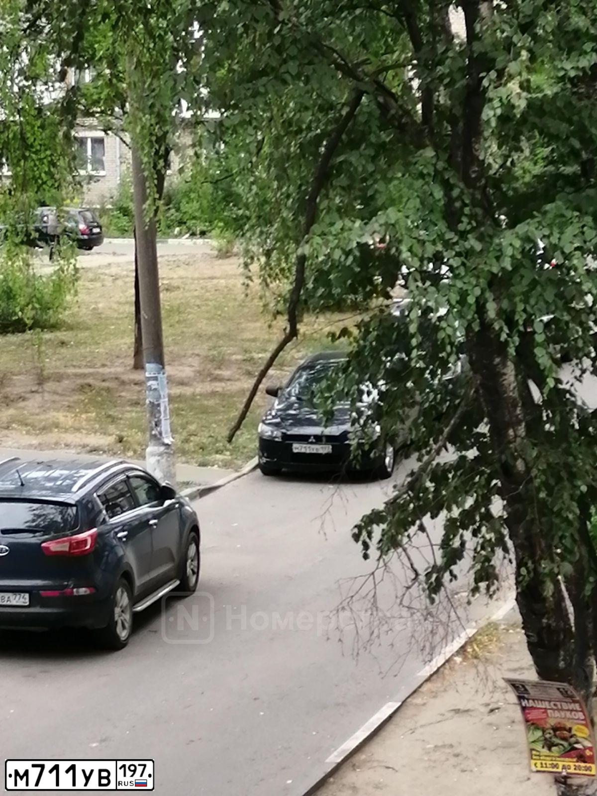Фото автомобиля MITSUBISHI LANCER, 2008 — госномер Х261ОО790. Цвет: ЧЕРНЫЙ
