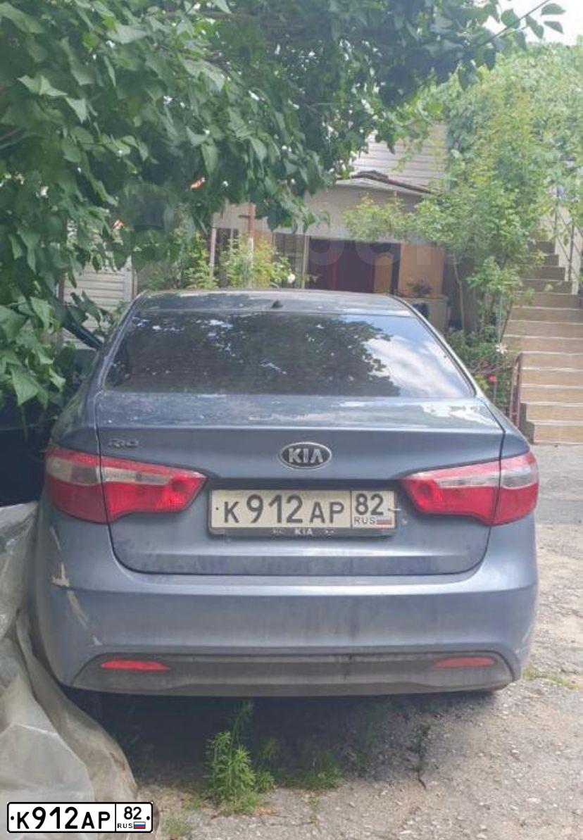Фото автомобиля KIA RIO, 2013 — госномер Н641КК82. Цвет: голубой