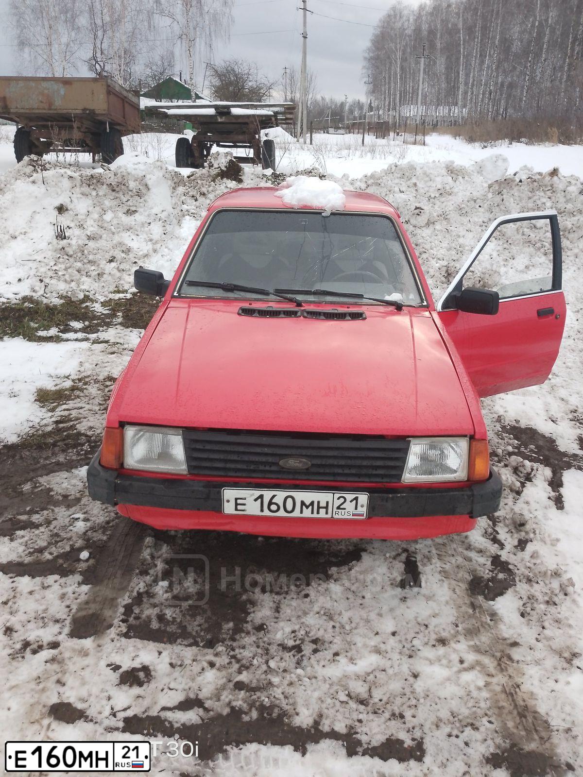 Фото автомобиля FORD ESCORT, 1983 — госномер Е160МН21. Цвет: КРАСНЫЙ