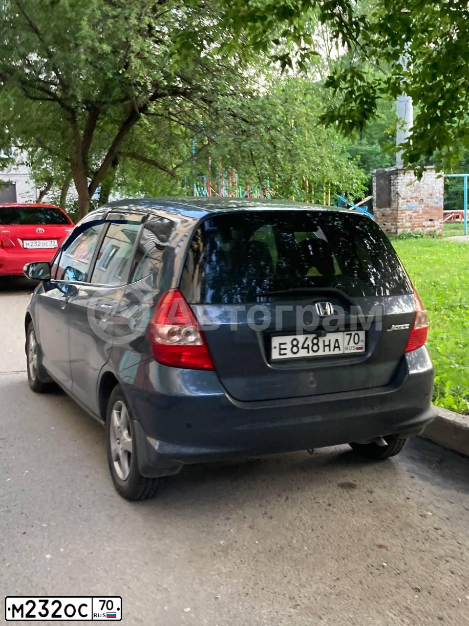 Фото автомобиля TOYOTA COROLLA, 2008 — госномер М232ОС70. Цвет: Красный