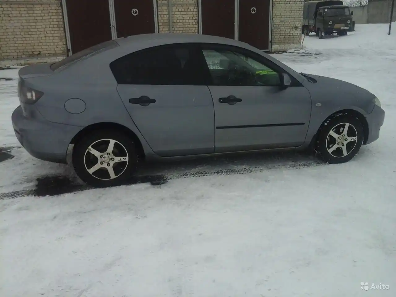 Фото автомобиля MAZDA 3, 2005 — госномер А171РМ62. Цвет: СЕРЫЙ