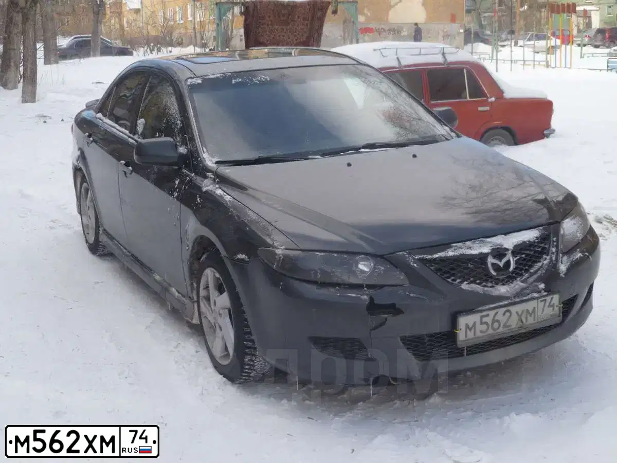 Фото автомобиля MAZDA 6, 2003 — госномер М562ХМ74. Цвет: ТЕМНО-СЕРЫЙ