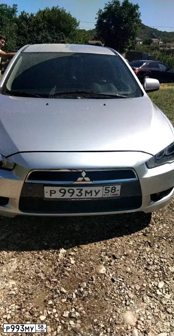 Фото автомобиля MITSUBISHI LANCER, 2008 — госномер М230АЕ185. Цвет: СЕРЕБРИСТЫЙ