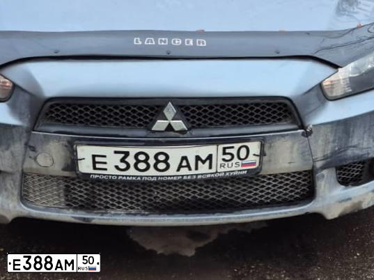 Фото автомобиля MITSUBISHI LANCER, 2010 — госномер Е388АМ50. Цвет: Серый