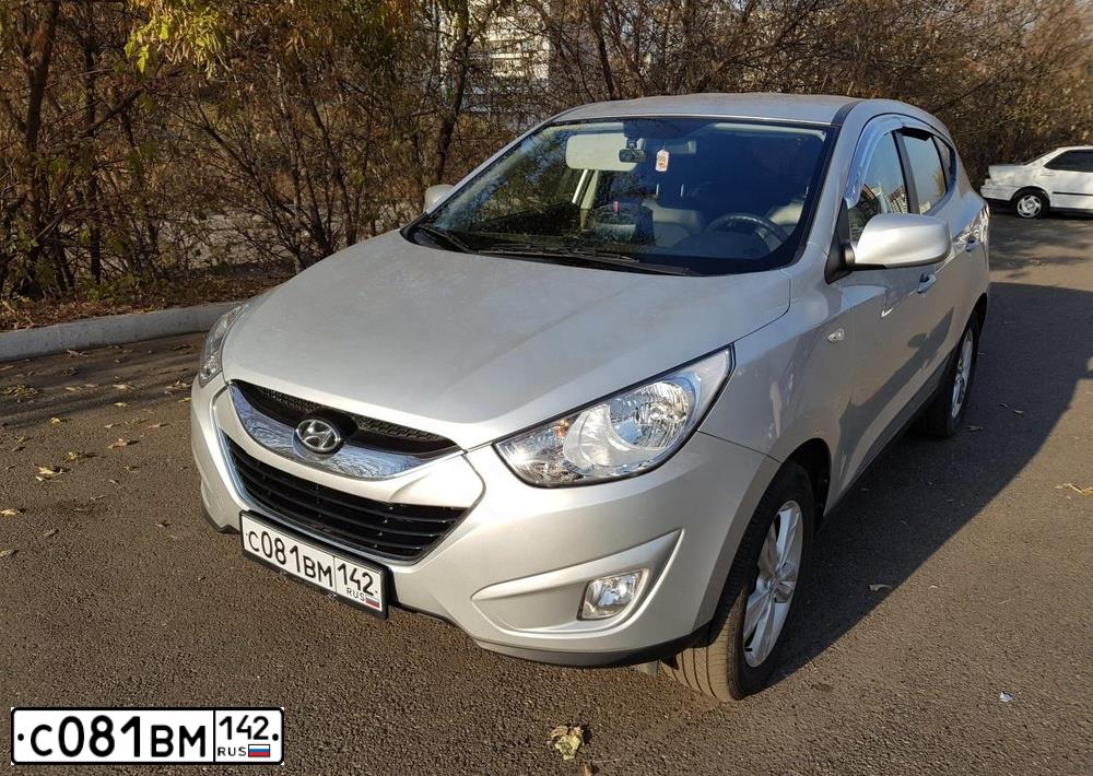 Фото автомобиля HYUNDAI TUCSON, 2011 — госномер О007ВТ19. Цвет: СЕРЫЙ