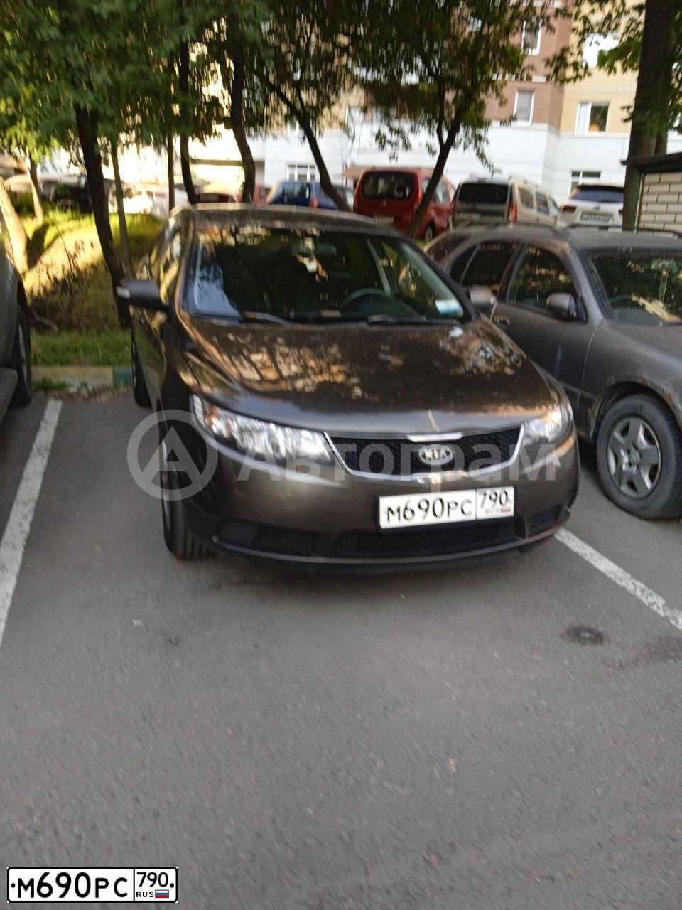 Фото автомобиля KIA CERATO, 2009 — госномер Н940СВ199. Цвет: бронзовый