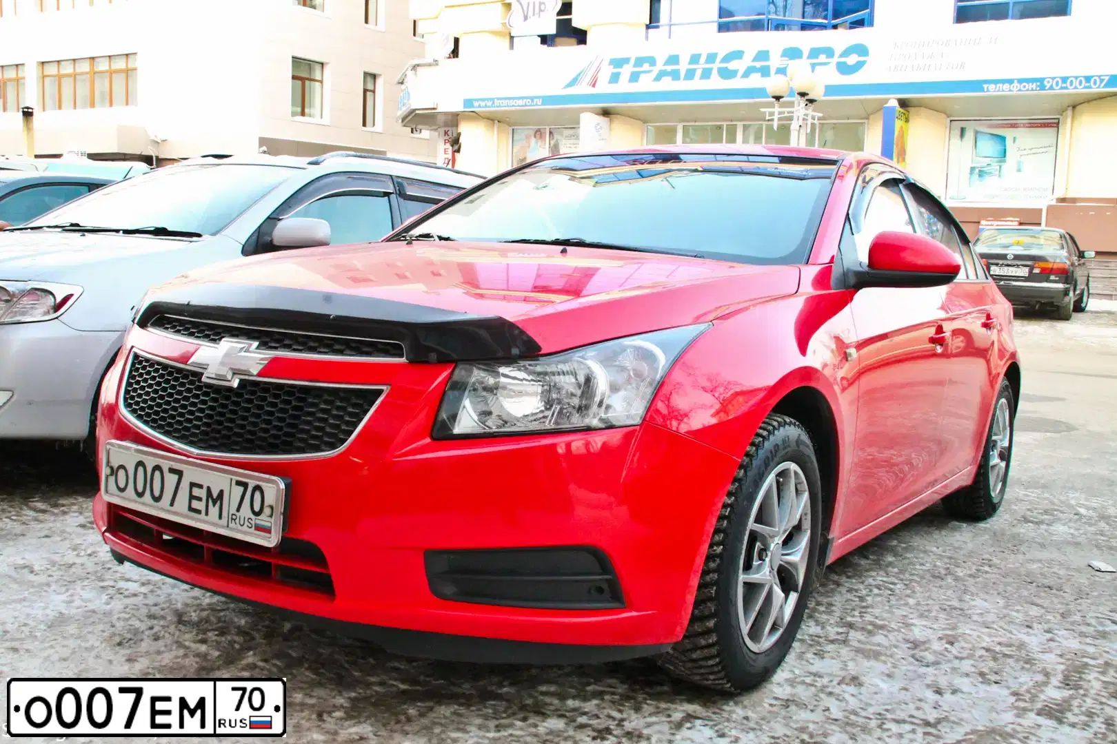 Фото автомобиля CHEVROLET CRUZE, 2009 — госномер О007ЕМ70. Цвет: Красный