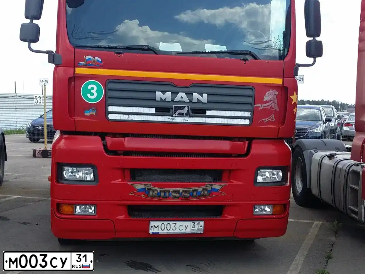 Фото автомобиля MAN TGA 18.XXX /4X2/, 2008 — госномер Е318АН95. Цвет: Красный