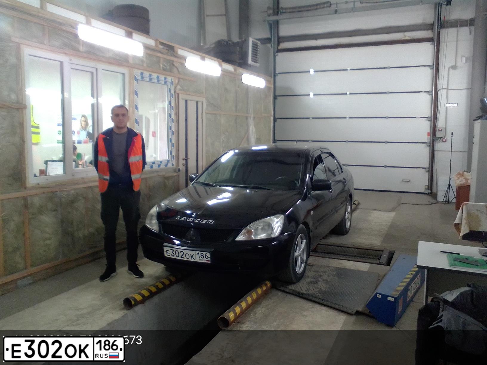 Фото автомобиля MITSUBISHI LANCER, 2009 — госномер Х901ХХ86. Цвет: ЧЕРНЫЙ