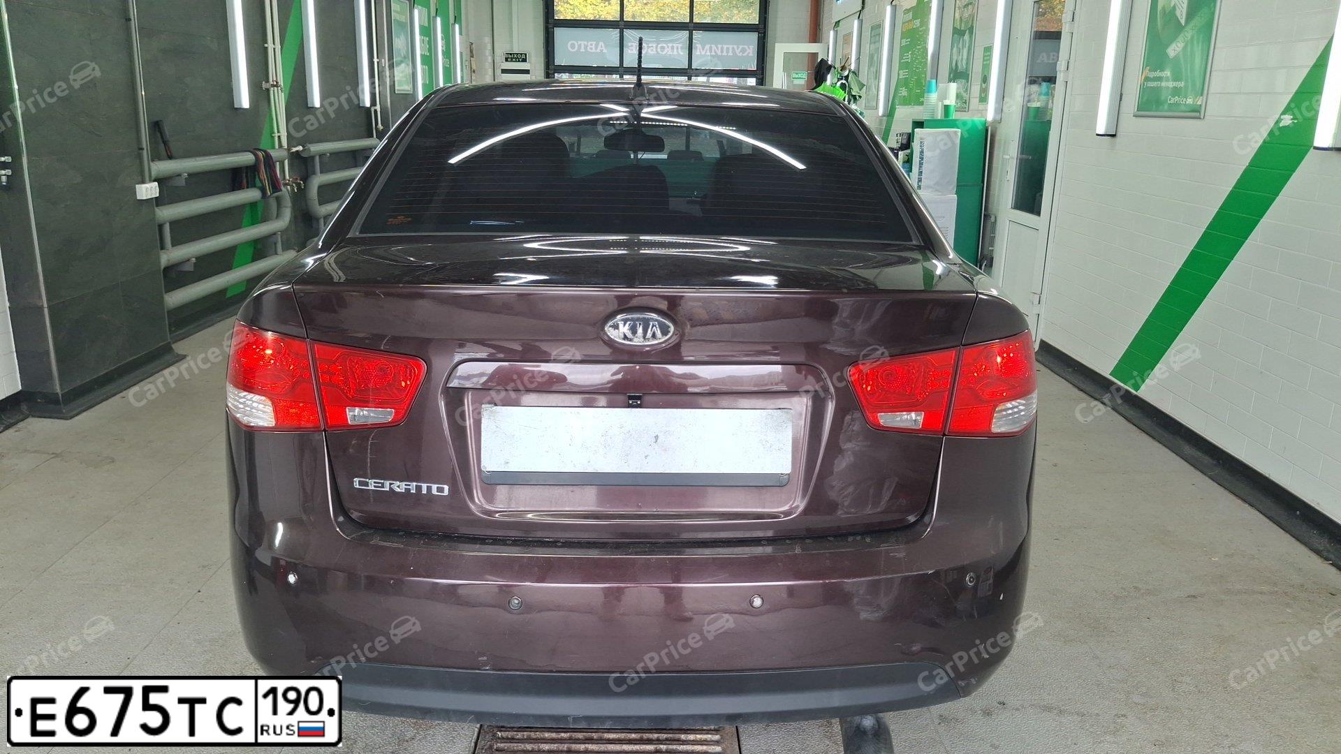 Фото автомобиля KIA CERATO, 2010 — госномер У645МХ761. Цвет: ТЕМНО-ВИШНЕВЫЙ