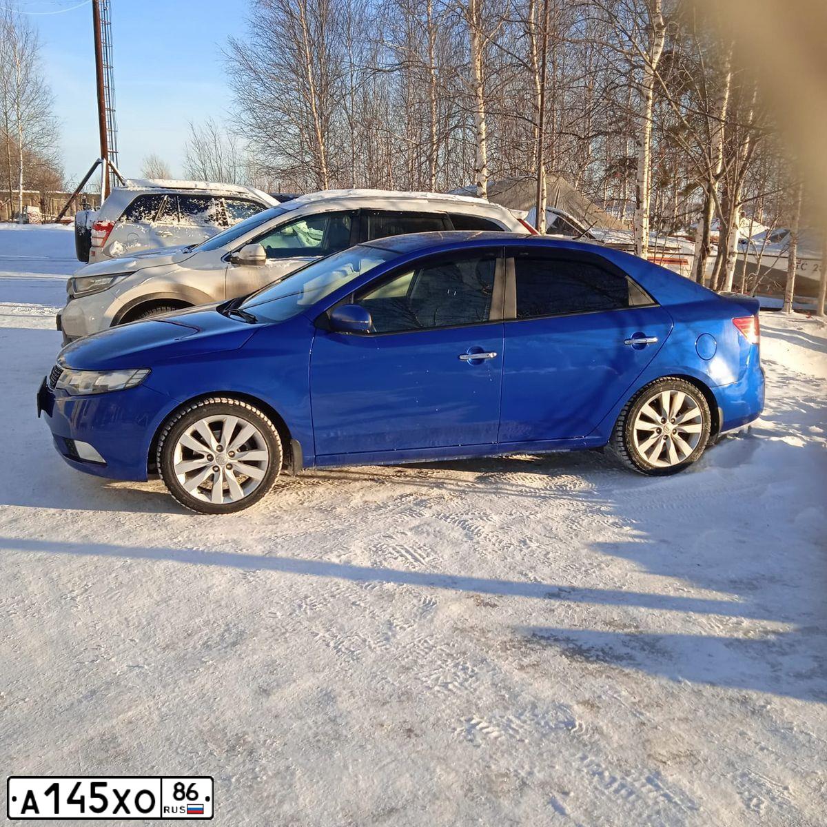 Фото автомобиля KIA CERATO, 2011 — госномер А145ХО86. Цвет: ГОЛУБОЙ