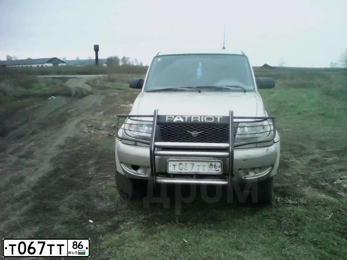 Фото автомобиля UAZ 2363 PICKUP, 2010 — госномер Т067ТТ86. Цвет: СЕРЕБ.ЖЕЛТ.МЕТАЛЛИК