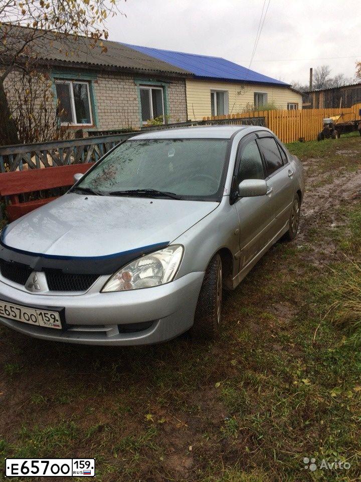 Фото автомобиля MITSUBISHI LANCER, 2005 — госномер Р940СА59. Цвет: СЕРЕБРИСТЫЙ