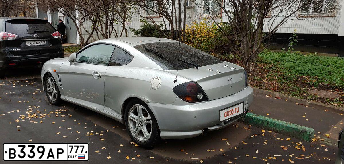 Фото автомобиля HYUNDAI /S-/COUPE / TUSCANI, 2002 — госномер В339АР777. Цвет: СЕРЫЙ