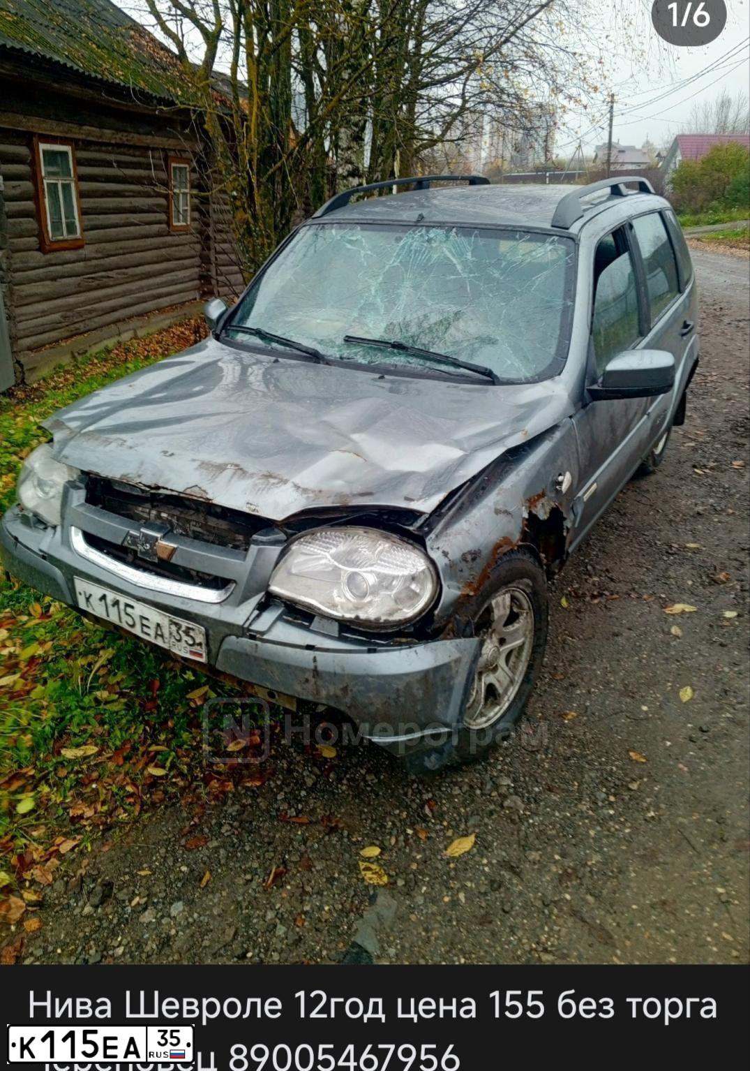 Фото автомобиля CHEVROLET NIVA, 2012 — госномер К115ЕА35. Цвет: Темно-серый металлик