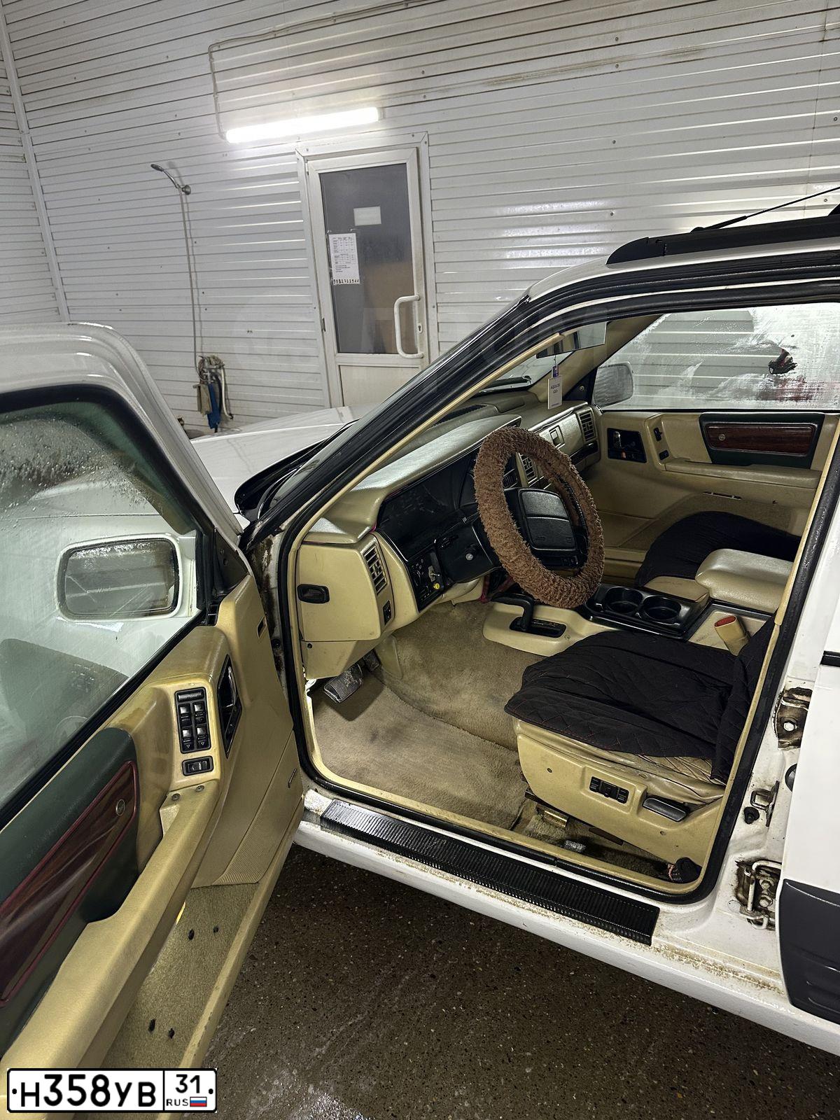 Фото автомобиля JEEP GRAND CHEROKEE, 1993 — госномер Н358УВ31. Цвет: БЕЛЫЙ