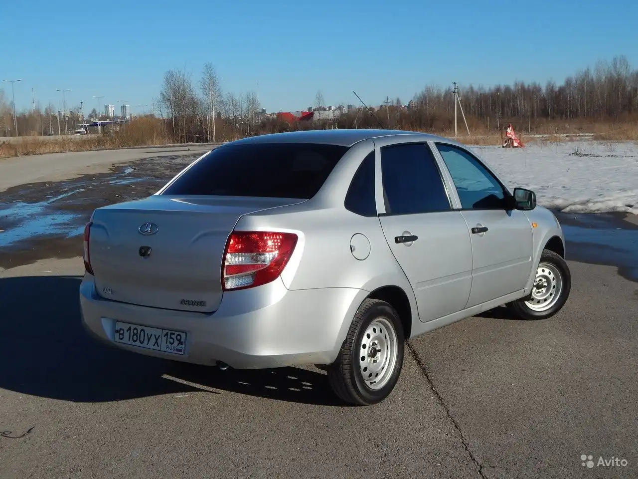 Фото автомобиля LADA GRANTA, 2013 — госномер В452НХ30. Цвет: СВЕТЛО-СЕРЫЙ