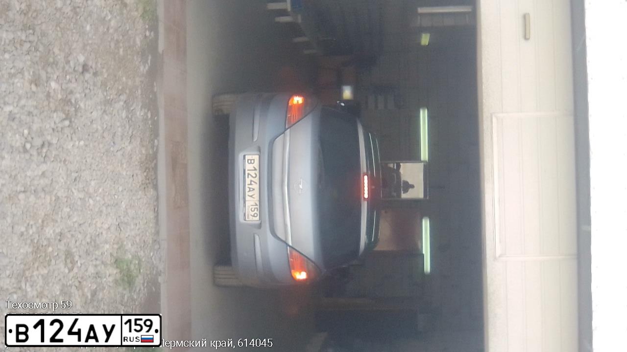 Фото автомобиля OPEL ASTRA, 2009 — госномер В124АУ159. Цвет: СЕРЫЙ