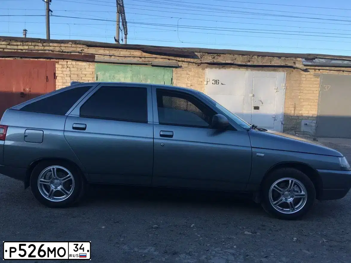 Фото автомобиля LADA 2112, 2007 — госномер Р526МО34. Цвет: СРЕДНИЙ СЕРО-ЗЕЛЕНЫЙ МЕТ.