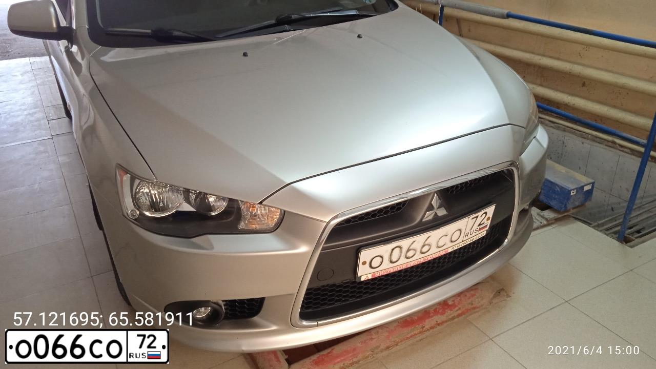 Фото автомобиля MITSUBISHI LANCER, 2012 — госномер О066СО72. Цвет: СЕРЕБРИСТЫЙ