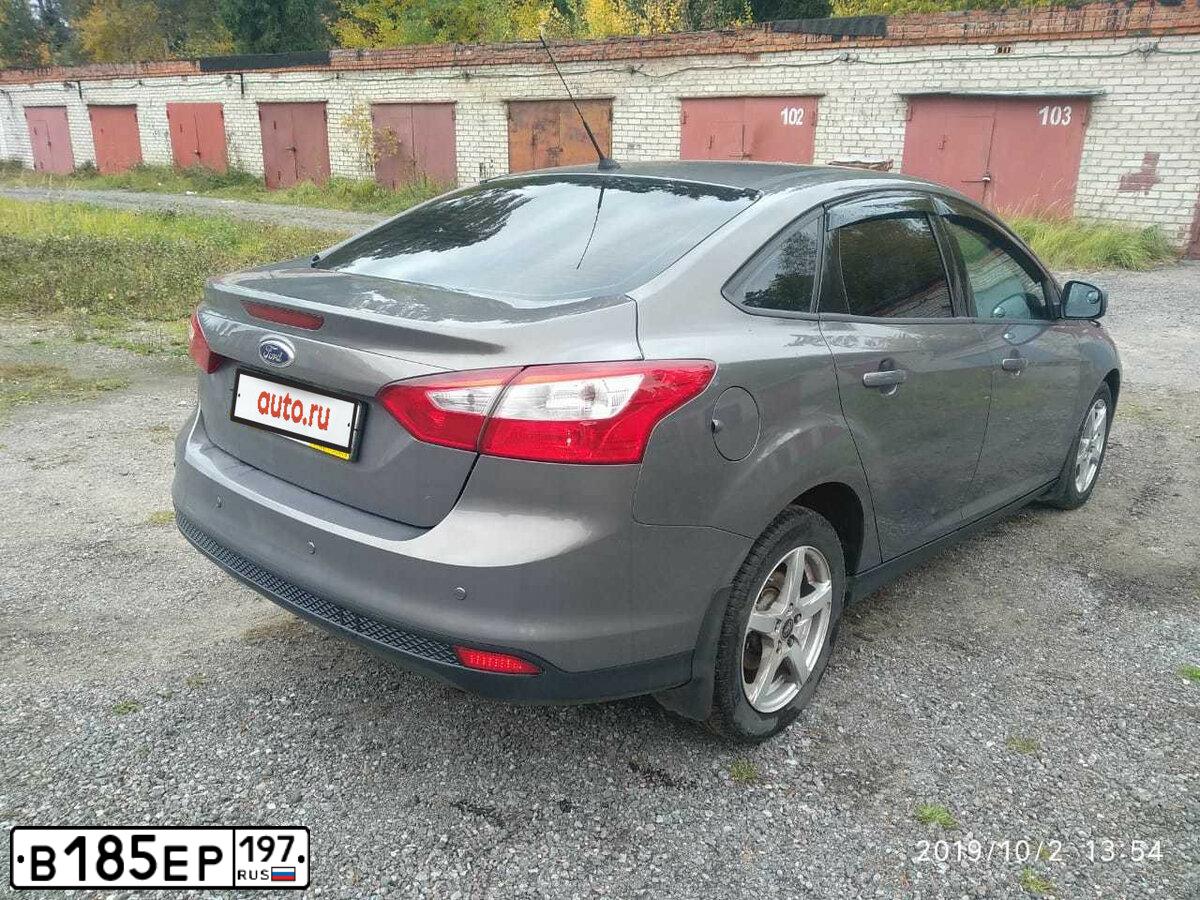 Фото автомобиля FORD FOCUS, 2014 — госномер Е115МА95. Цвет: СЕРО-КОРИЧНЕВЫЙ