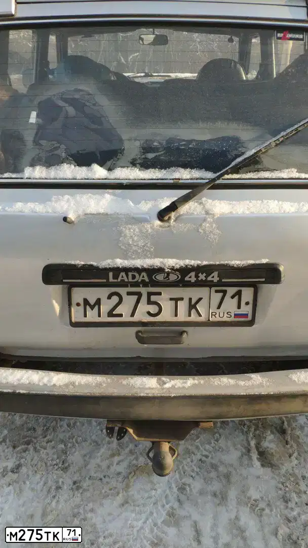 Фото автомобиля LADA 2131 NIVA, 2011 — госномер Т123ОР71. Цвет: Светло-Серебристый металлик