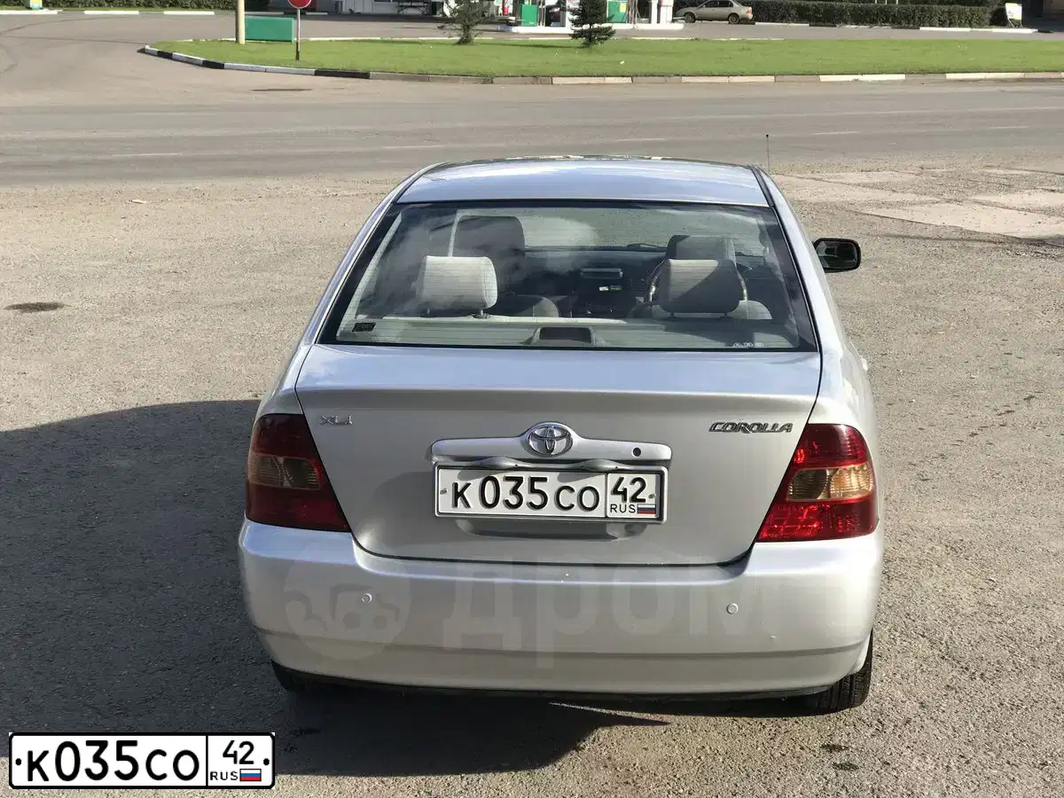 Фото автомобиля TOYOTA COROLLA, 2002 — госномер К035СО42. Цвет: Серый