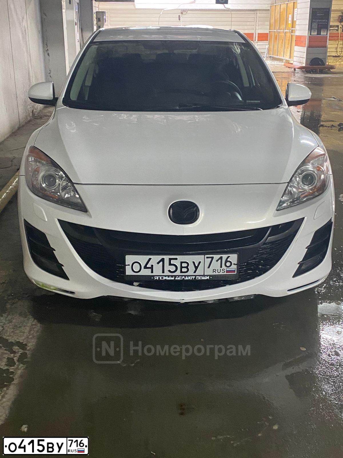 Фото автомобиля MAZDA A 3, 2010 — госномер О415ВУ716. Цвет: Белый
