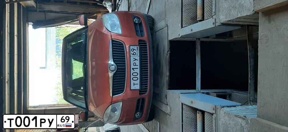 Фото автомобиля SKODA FABIA, 2009 — госномер К850УО69. Цвет: ОРАНЖЕВО-КРАСНЫЙ